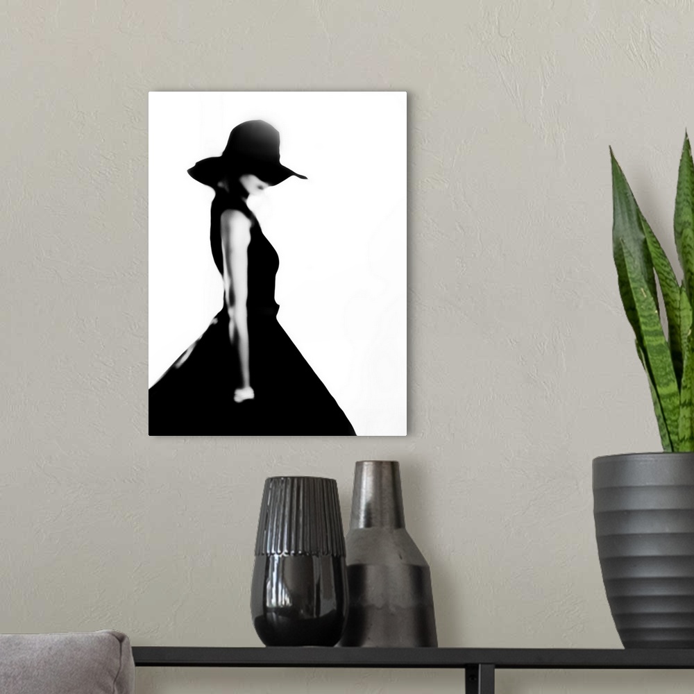 A modern room featuring Stylish woman in black dress