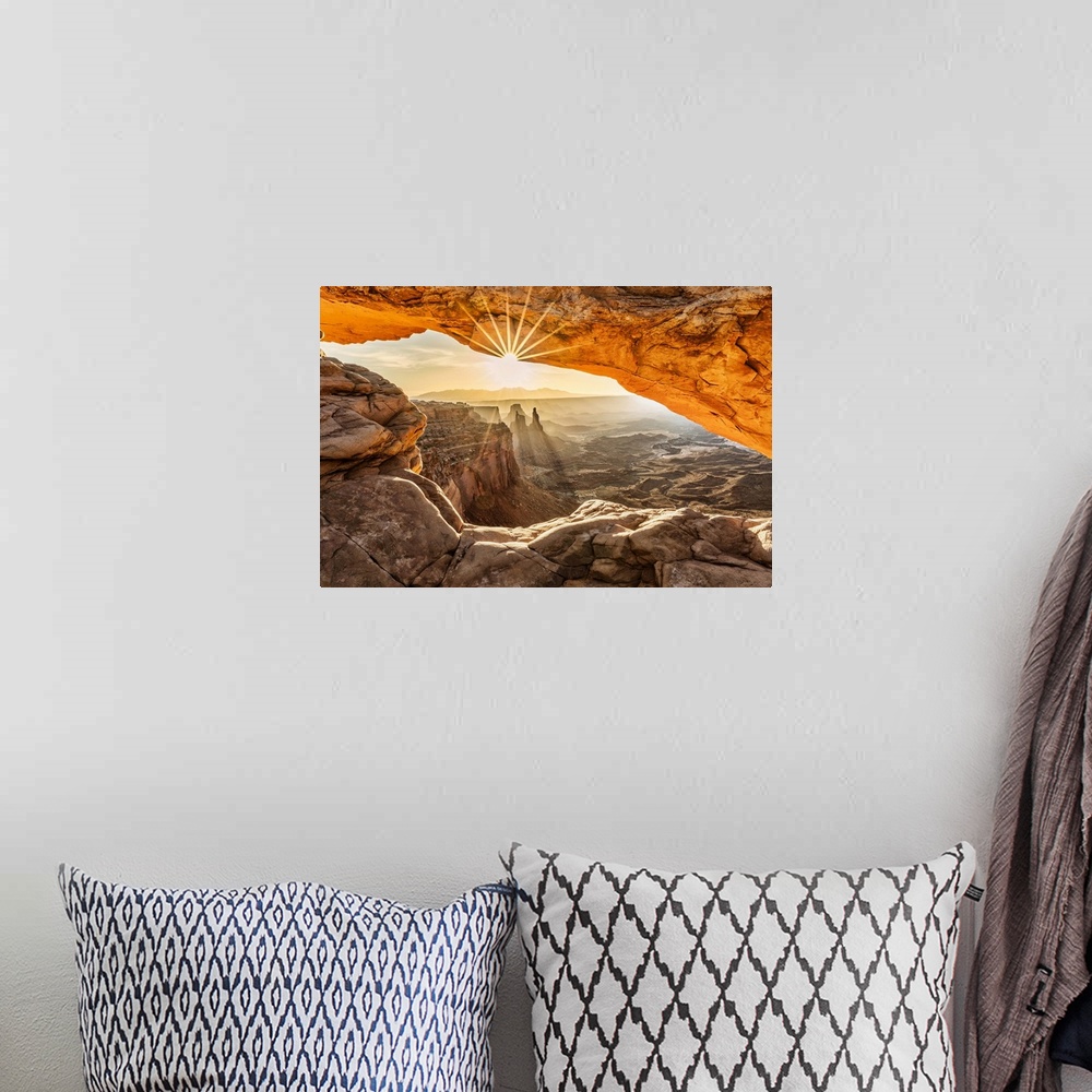 A bohemian room featuring Sunrise over Mesa Arch in Canyondlands National Park in Moab.