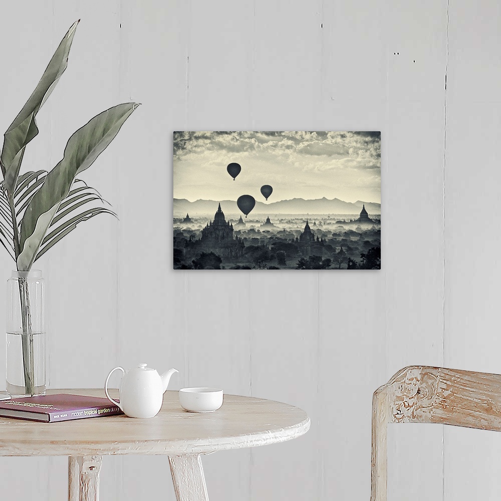 A farmhouse room featuring This monochromatic photograph shows a landscape of hot air balloons rising above the stupas of an...