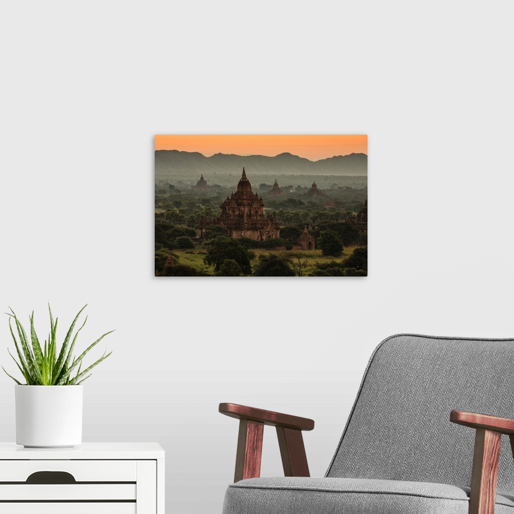 A modern room featuring Sunrise with temples in Bagan, Burma.