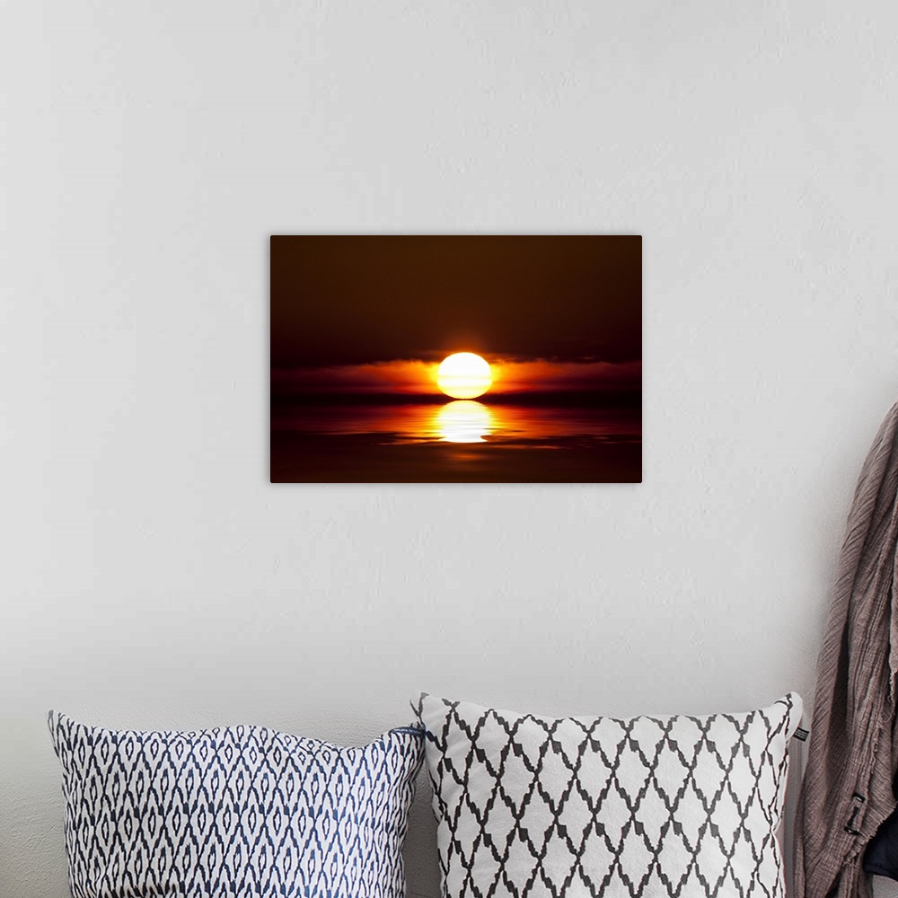 A bohemian room featuring Sunset touching the water