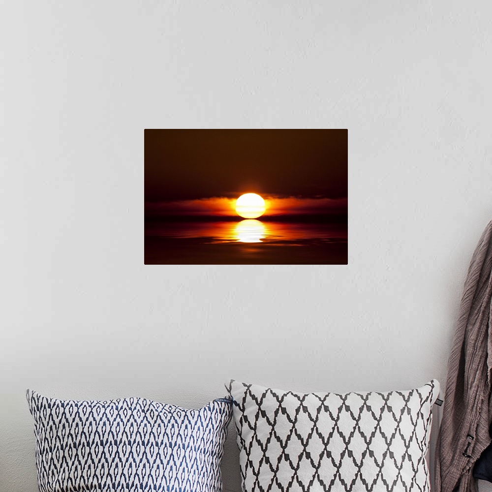 A bohemian room featuring Sunset touching the water