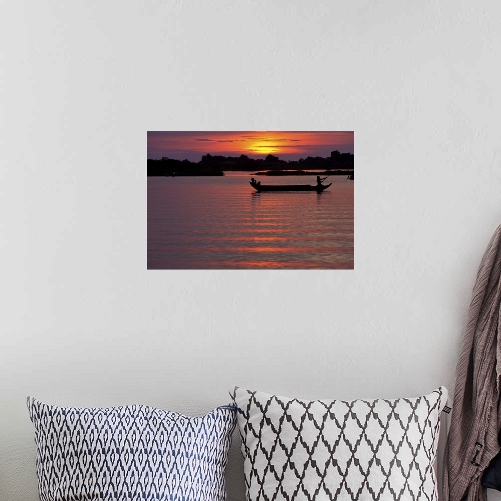 A bohemian room featuring Sunset with fishing boats, Siem Reap, Cambodia