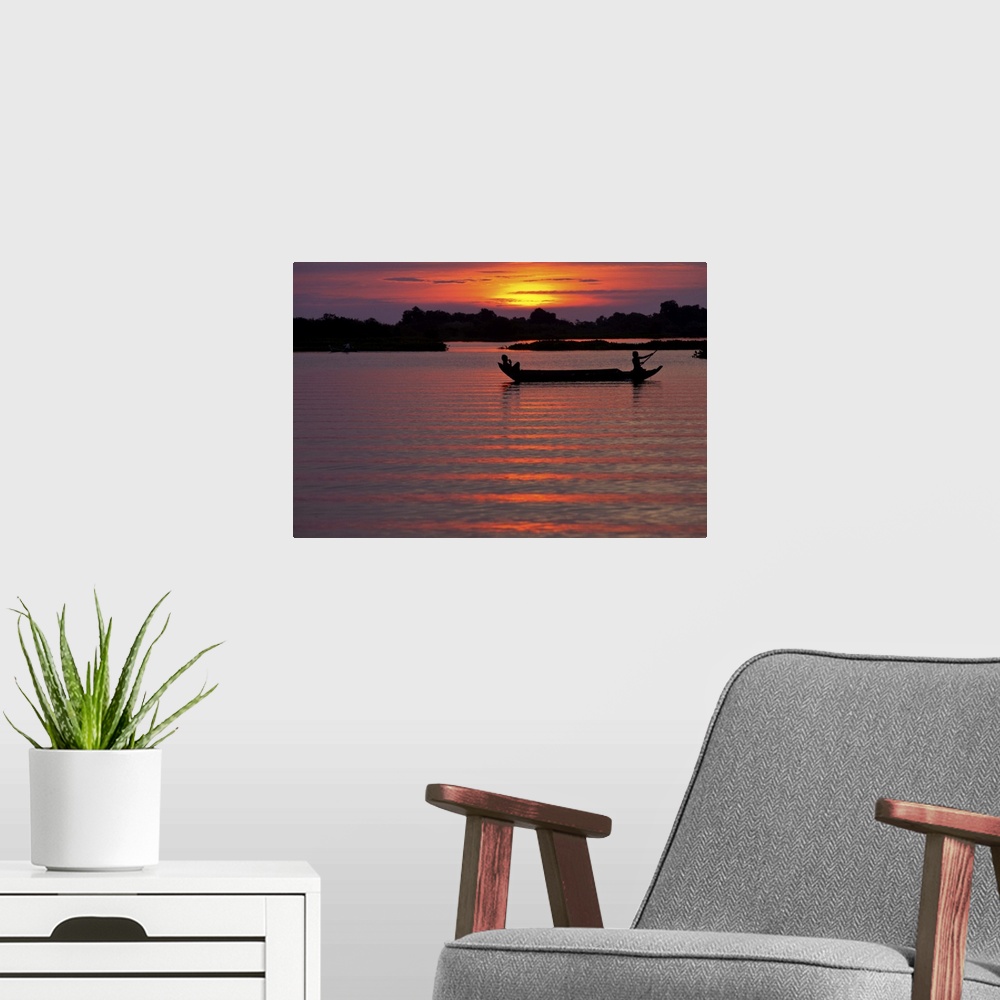 A modern room featuring Sunset with fishing boats, Siem Reap, Cambodia