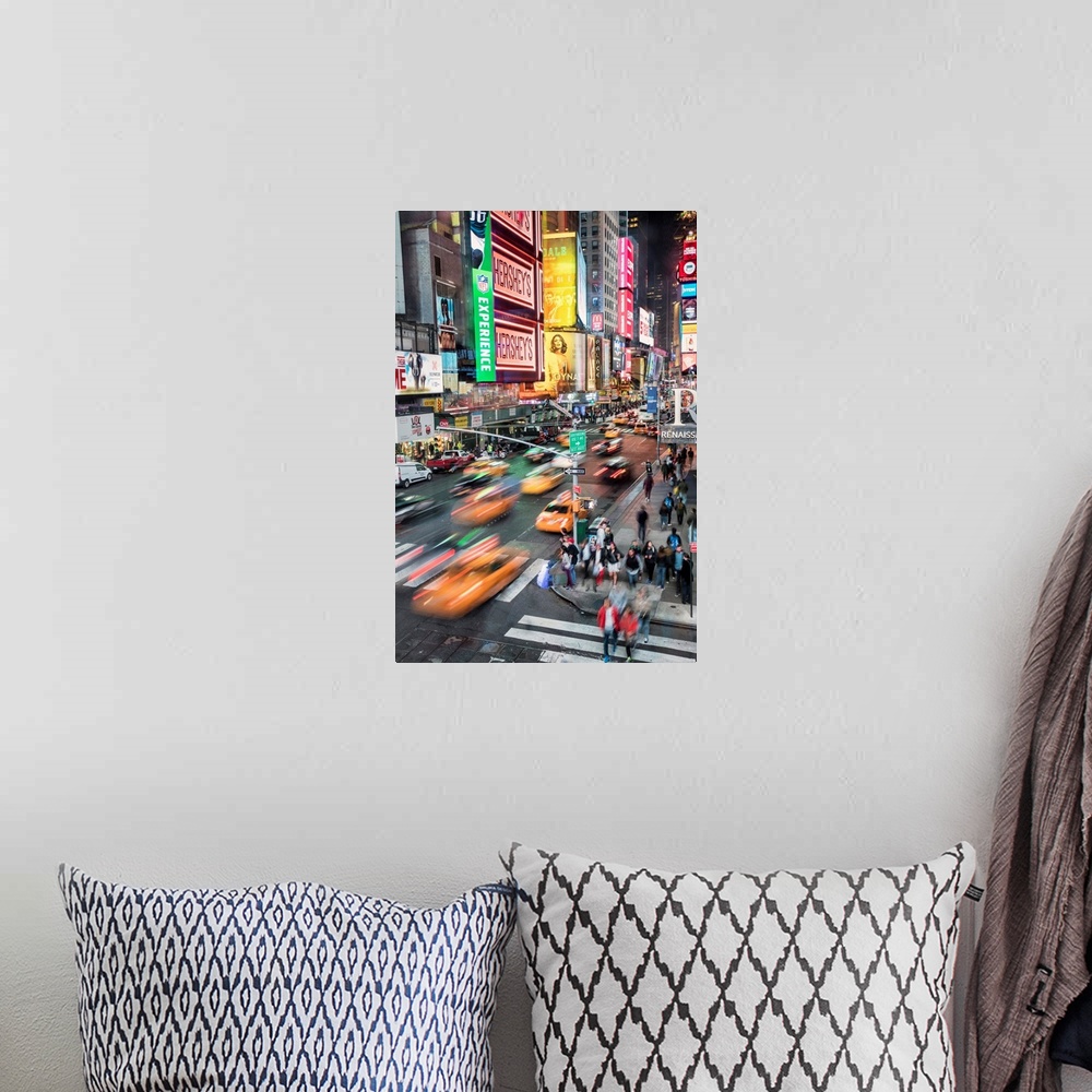 A bohemian room featuring Taxis and traffic in Times Square in New York City
