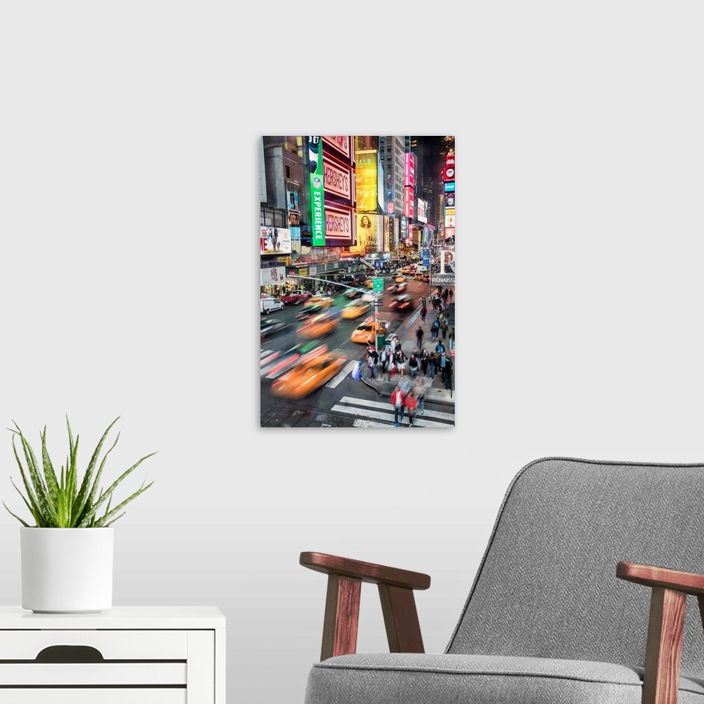 A modern room featuring Taxis and traffic in Times Square in New York City
