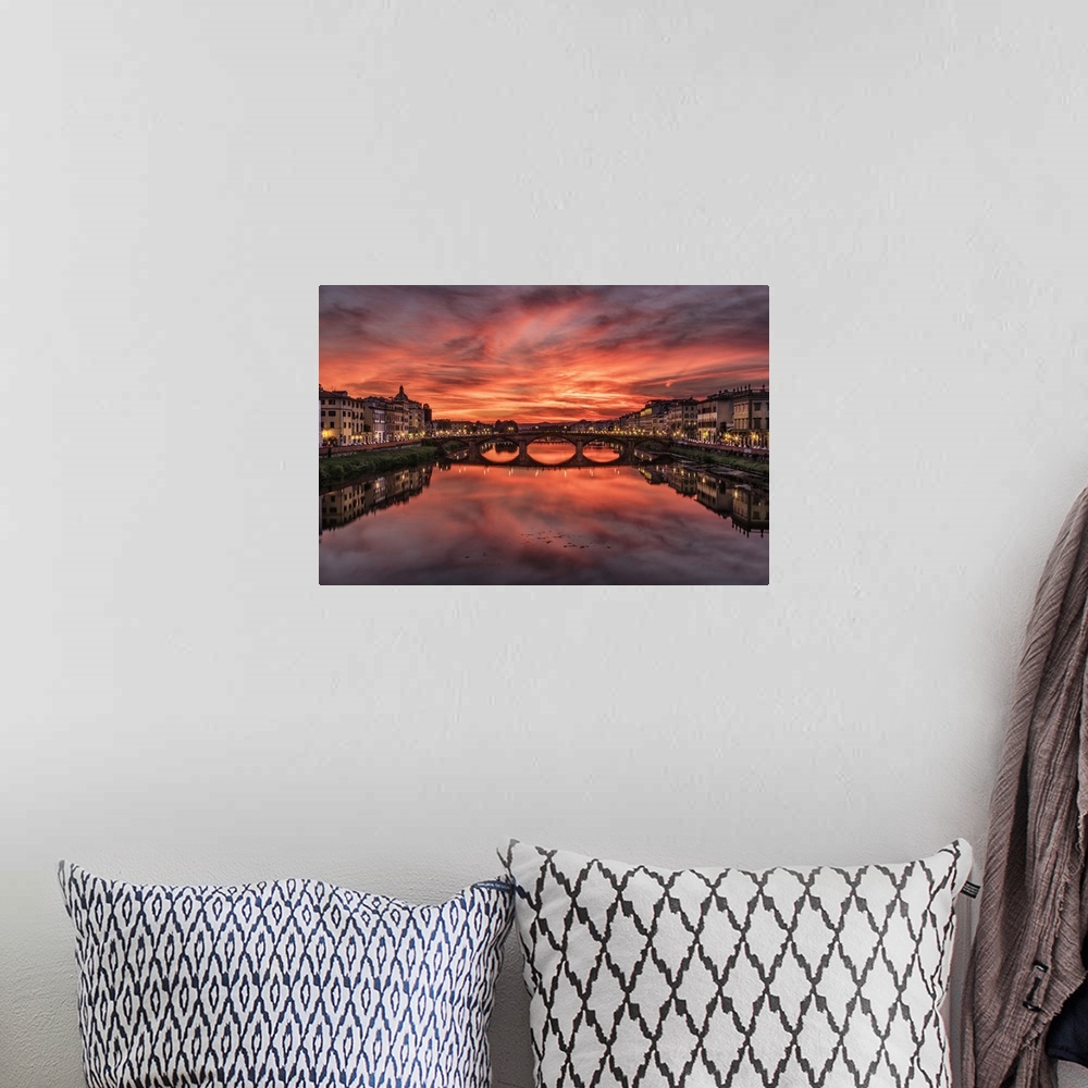 A bohemian room featuring The Arno River at sunset in Florence, Italy