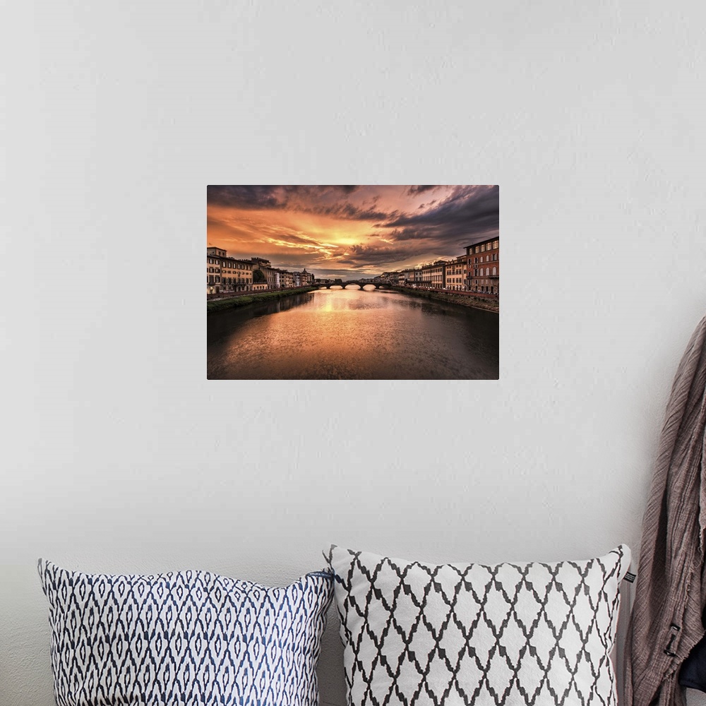 A bohemian room featuring The Arno River at sunset in Florence, Italy
