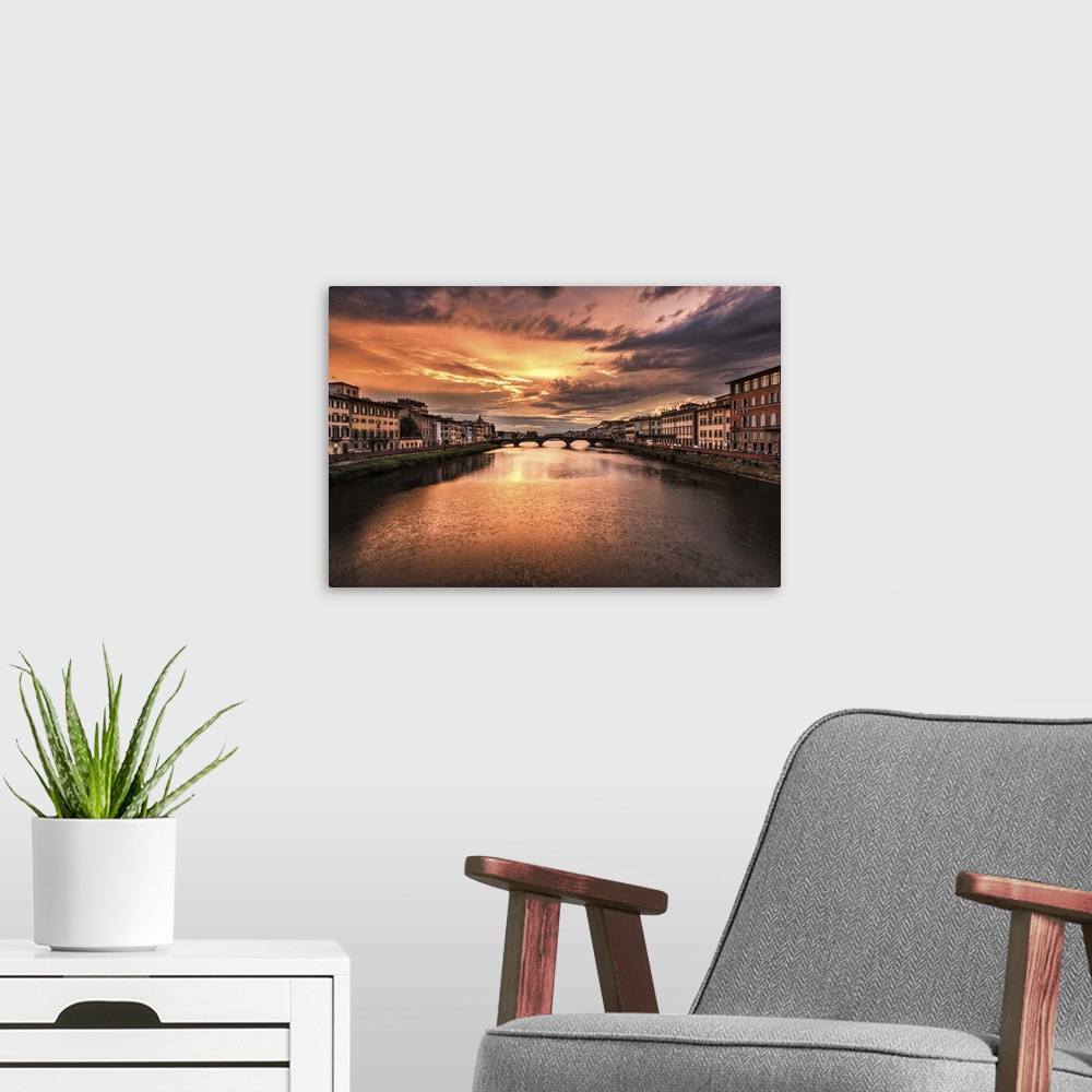 A modern room featuring The Arno River at sunset in Florence, Italy