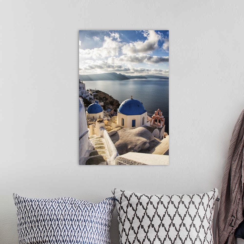 A bohemian room featuring The blue churches of Oia Santorini