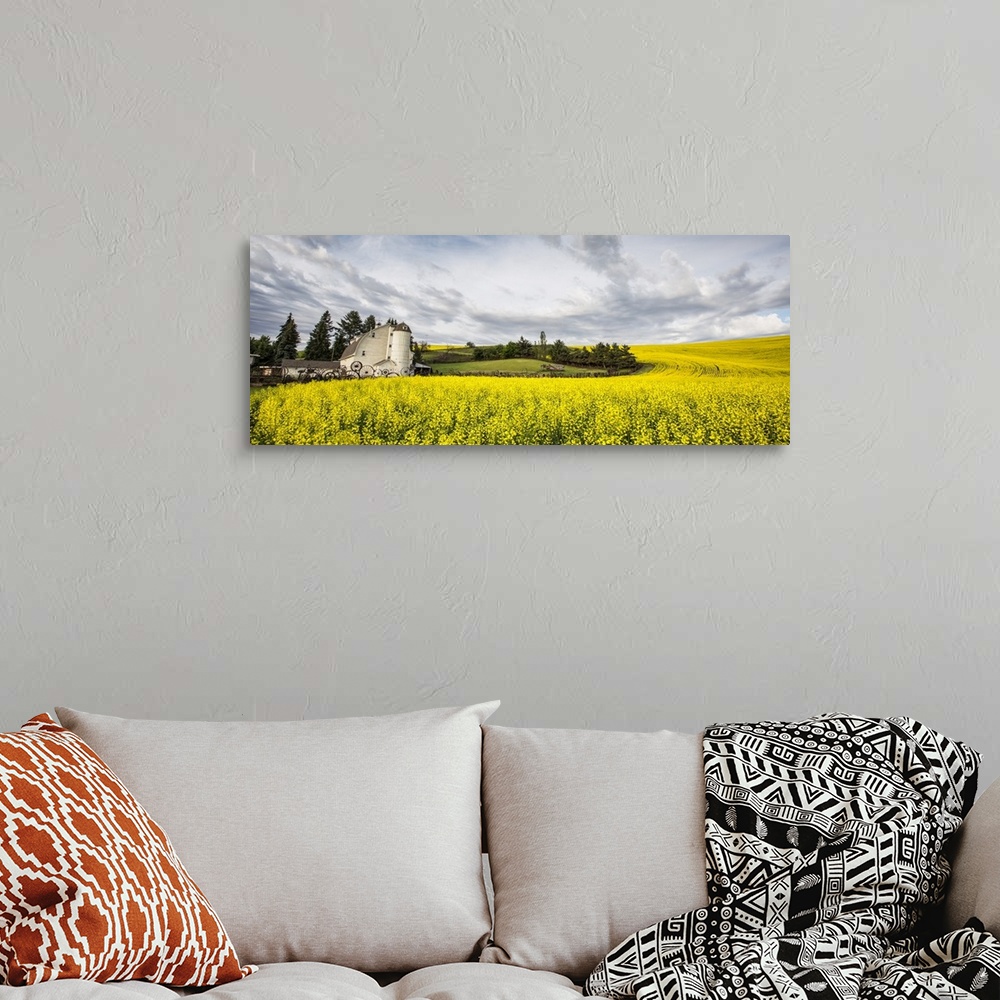 A bohemian room featuring The Dahmen Barn and yellow Cannola Fields in the Palouse, Washington