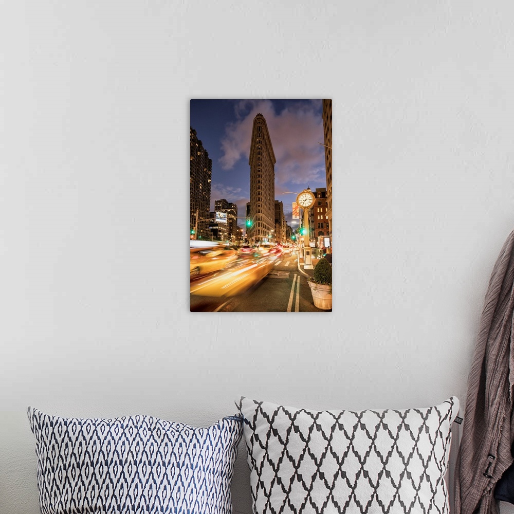 A bohemian room featuring The Flatiron Building in New York City at sunset