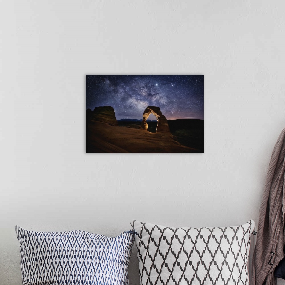 A bohemian room featuring The Milky Way over Delicate Arch in Arches National Park