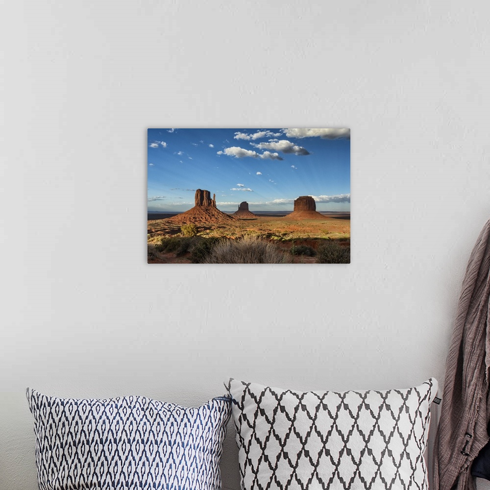 A bohemian room featuring The MIttens at sunset in Monument Valley, Utah
