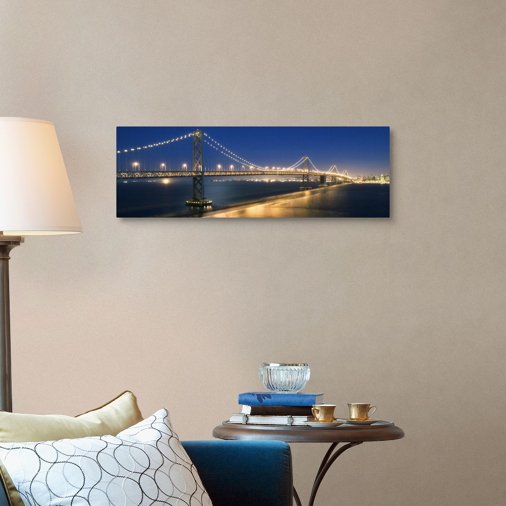 A traditional room featuring The Oakland Bay Bridge after dark in San Francisco