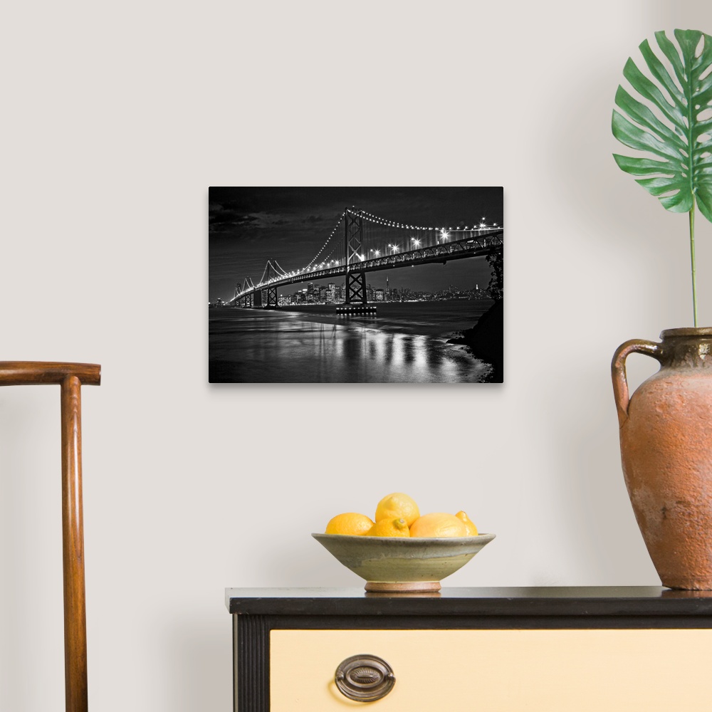 A traditional room featuring This landscape is a high contrast, monochromatic photograph that shows a bridge in the fore groun...