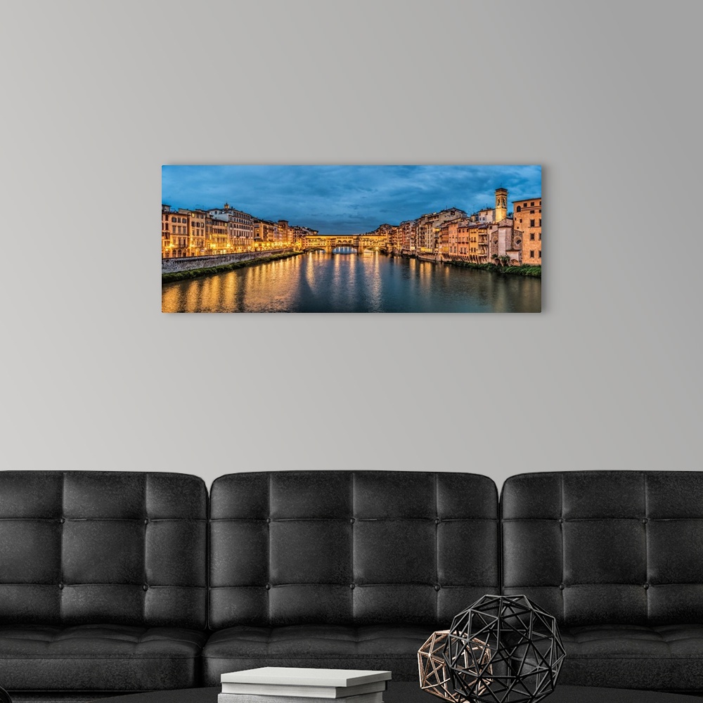A modern room featuring The Pontevecchio Bridge in Florence after dark.