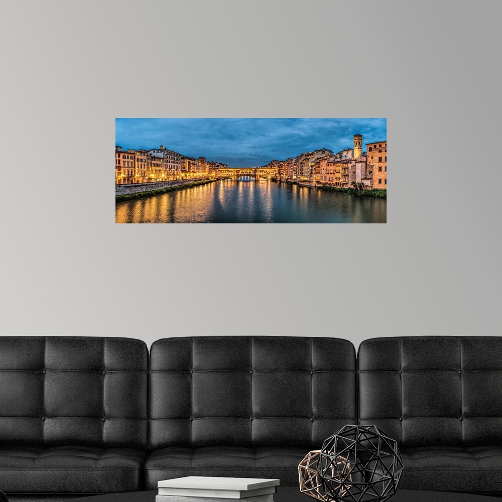 A modern room featuring The Pontevecchio Bridge in Florence after dark.