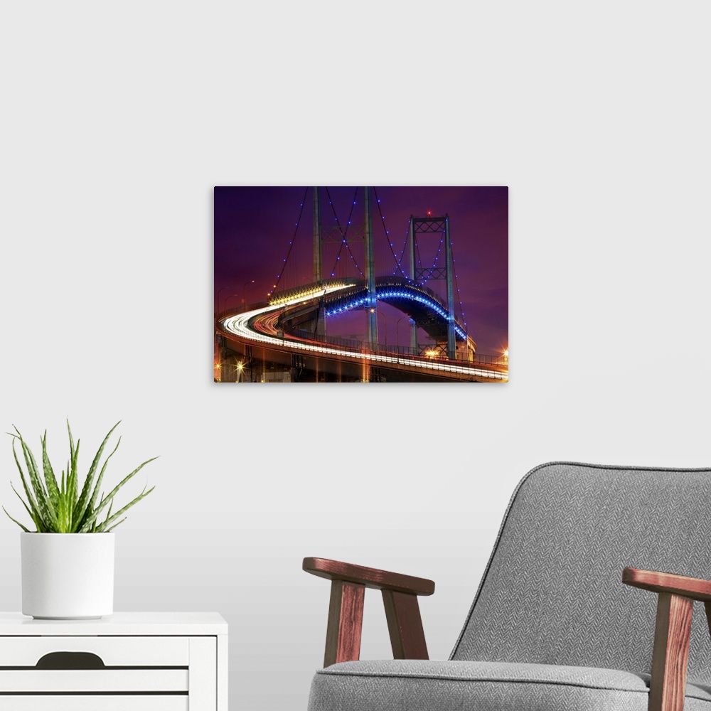 A modern room featuring The Vincent Thomas Bridge after dark, Los Angeles, California