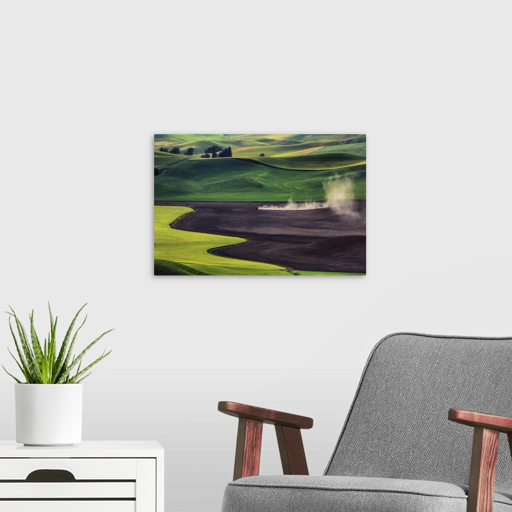 A modern room featuring Tractor working in the wheat fields of the Palouse, Washington.