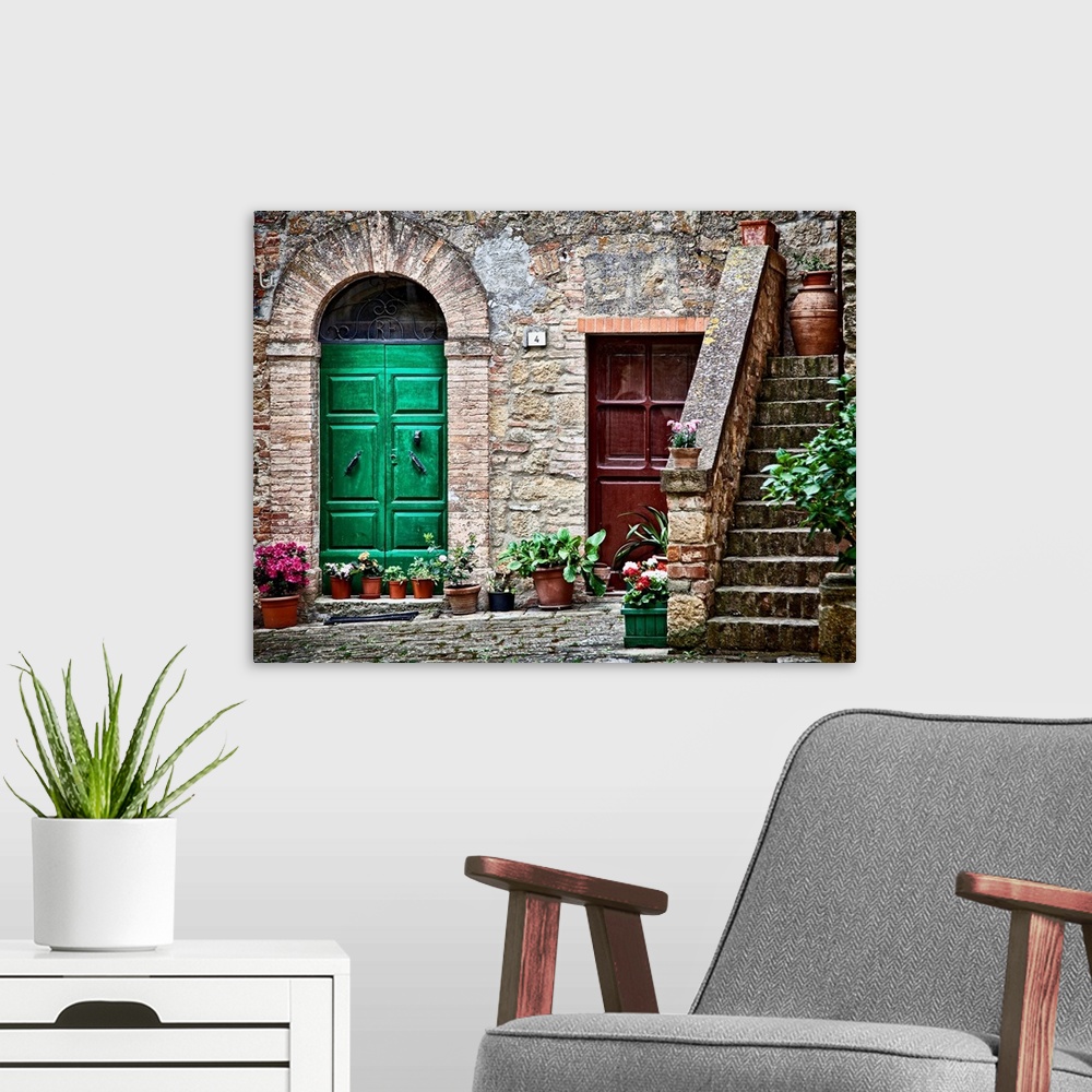 A modern room featuring A rustic city street and ancient home built from stone and brick with brightly painted doorways l...