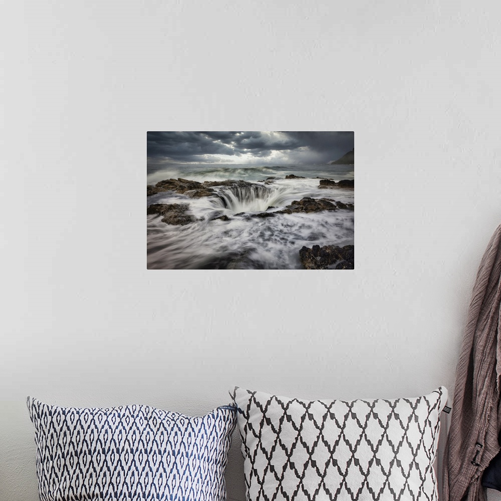 A bohemian room featuring Waves crashing into Thors Well on the Oregon Coast.