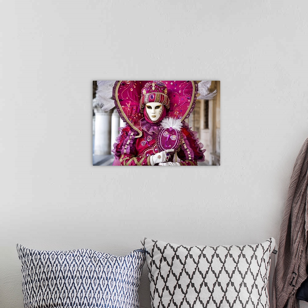 A bohemian room featuring Woman in masquerade outfit at Carnival in Venice, Italy.