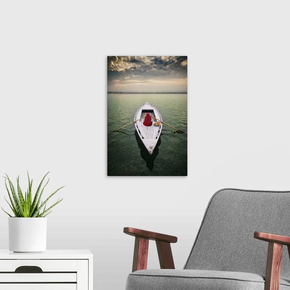A modern room featuring Woman on longtail boat on the Ganges River, Varinasi, India