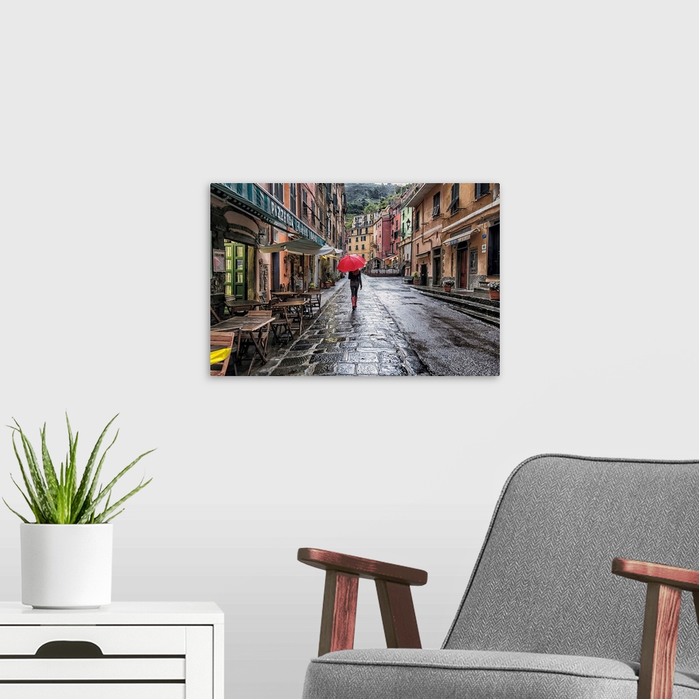 A modern room featuring Woman with red umbrella in the rain in Vernazza, Italy