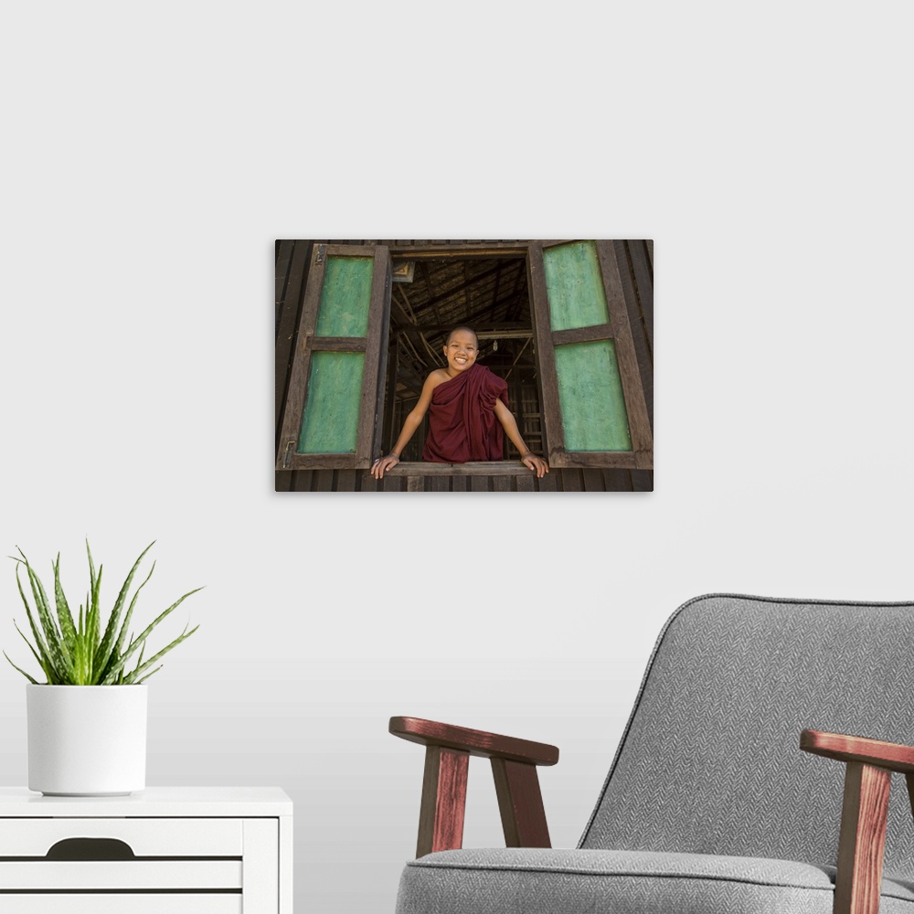 A modern room featuring Young Burmese monk in his monastery