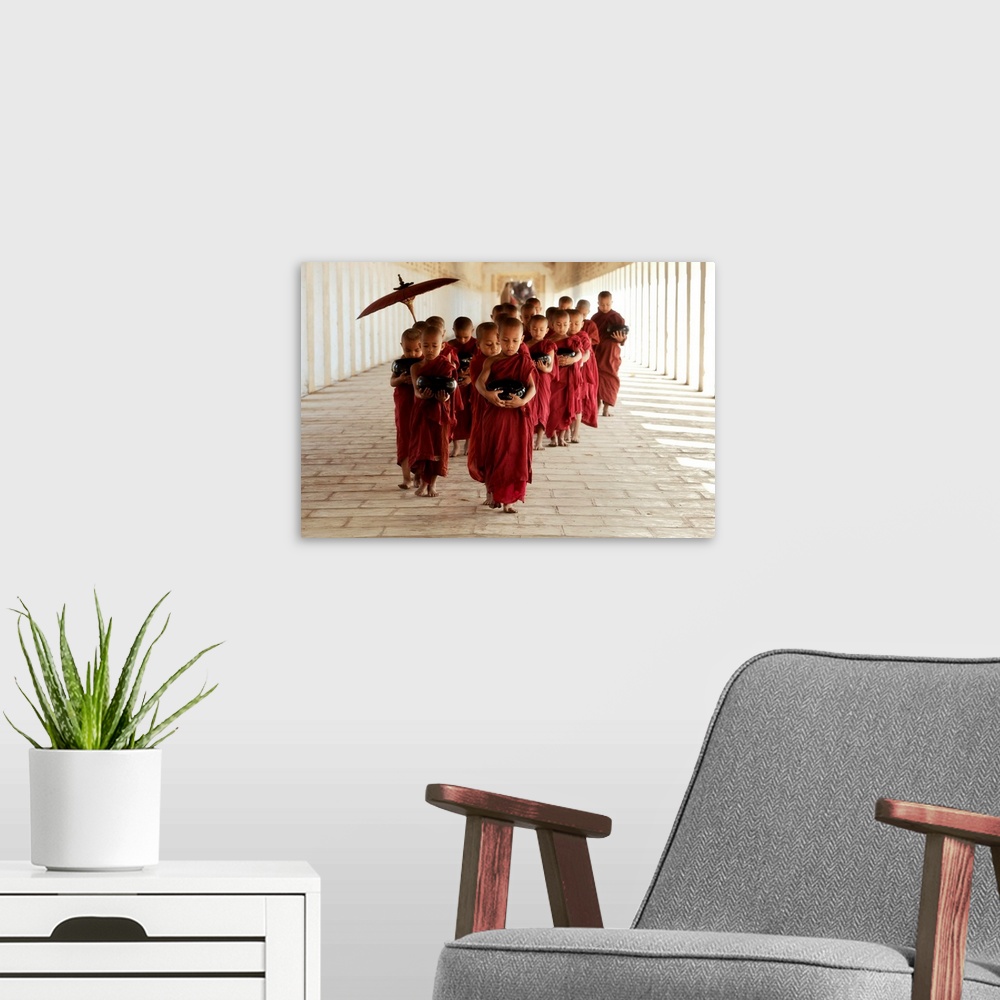A modern room featuring Young monks walking in their monastery, Bagan, Burma