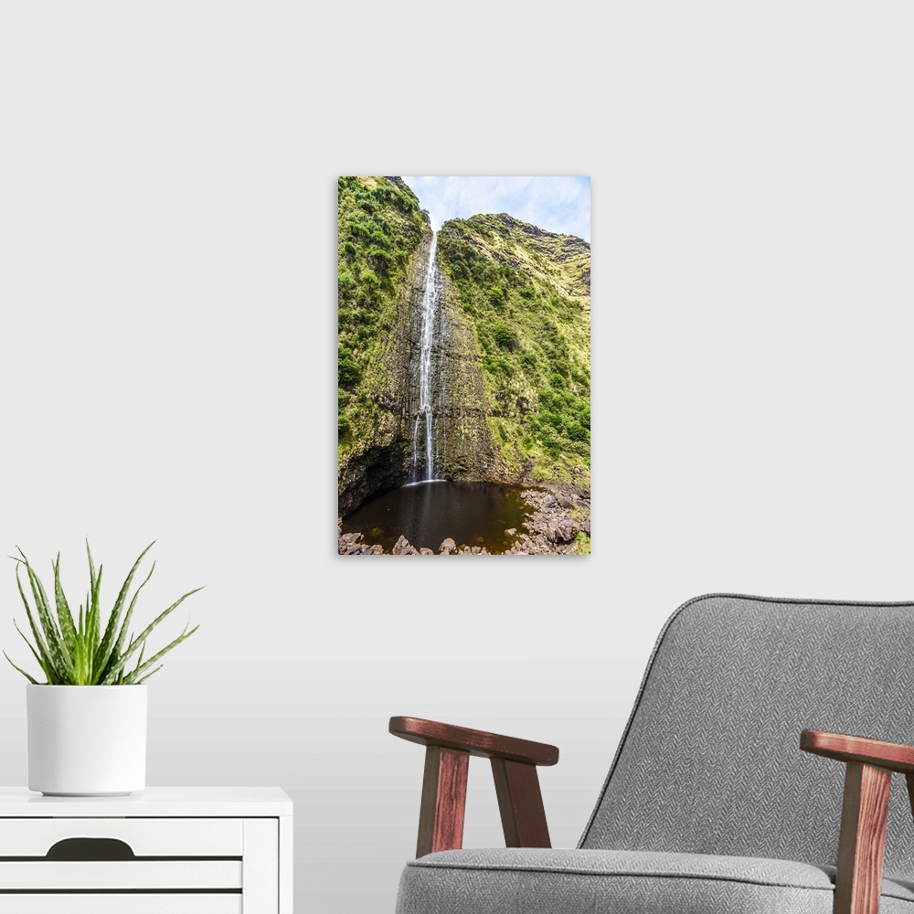 A modern room featuring Big Island Hawaii. A waterfall on the big island's inaccessible northeast shore.