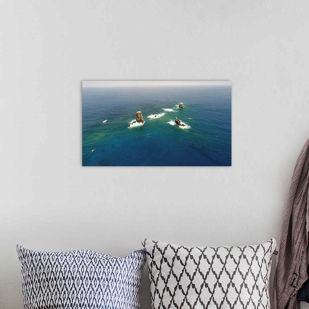 A bohemian room featuring Aerial photograph of Alijos Rocks off the coast of Mexico