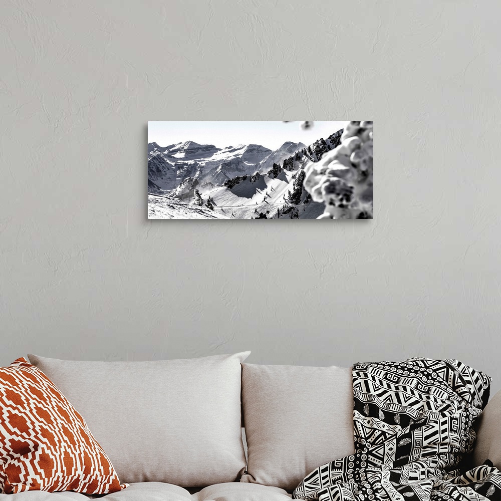 A bohemian room featuring Black and white landscape photograph of the Wasatch Range in Utah with a skier hiking up in the m...
