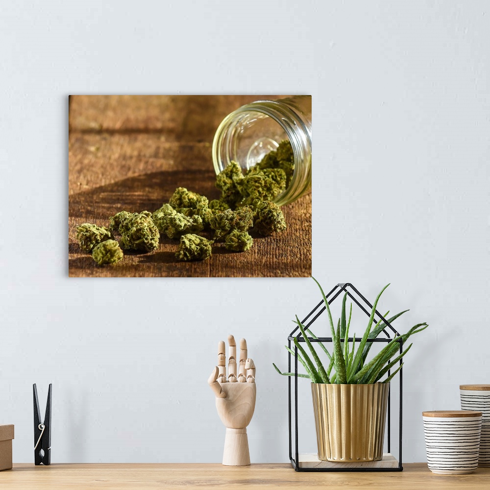 A bohemian room featuring A glass bowl with harvested cannabis spilling out of it.