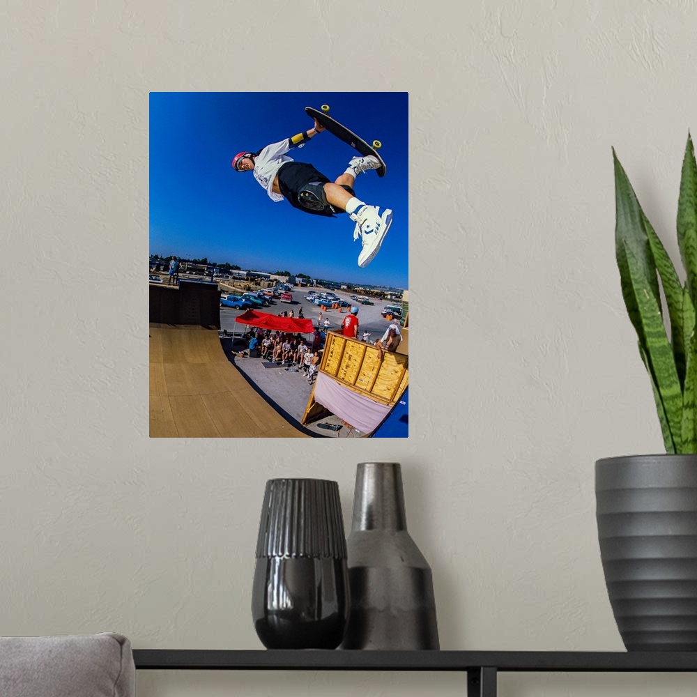 A modern room featuring Christian Hosoi skateboarding through the air at Vans Off The Wall Skatepark in Huntington Beach,...
