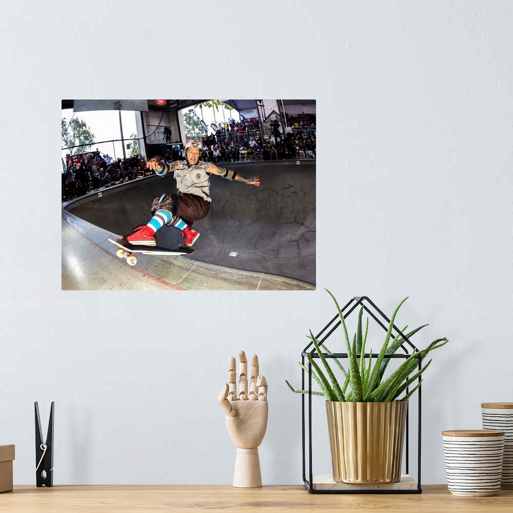 A bohemian room featuring Duana Peters skateboarding at the Vans Pool Party in Vans Skatepark in Orange, California, 2015.