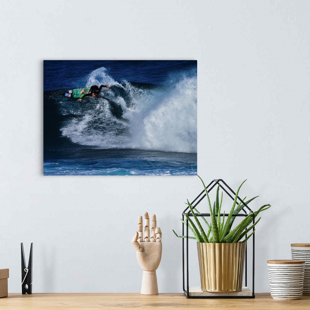 A bohemian room featuring Flynn Novak surfing at Rocky Point, North Shore, Oahu, Hawaii