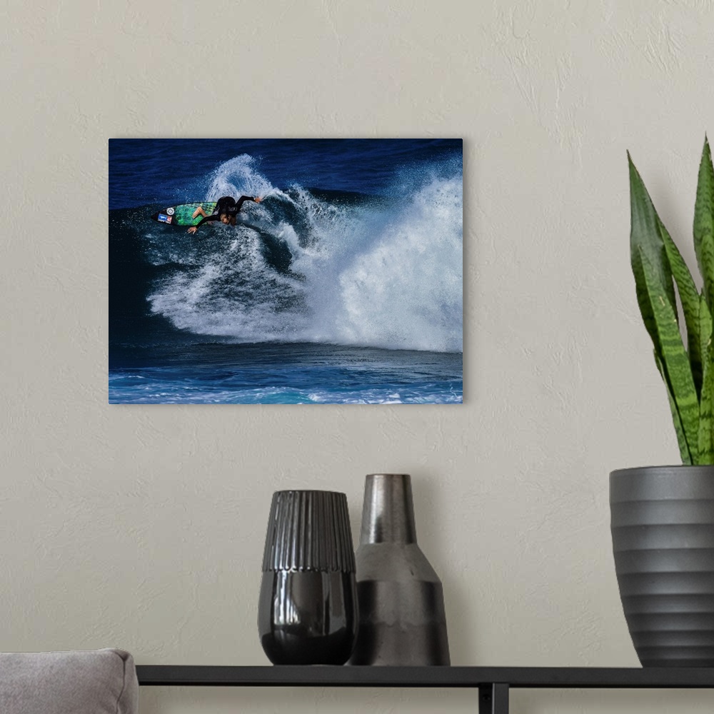 A modern room featuring Flynn Novak surfing at Rocky Point, North Shore, Oahu, Hawaii