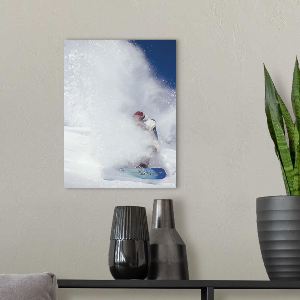 A modern room featuring Ian Spiro almost hidden in a cloud of snow, snowboarding at North Cascade Heli Skiing, Mazama, Wa...
