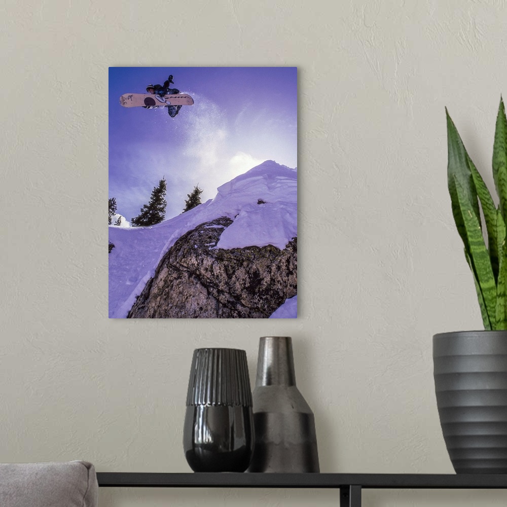 A modern room featuring Jay Nelson flying on his snowboard over the Loveland Pass, Colorado, in the mid 90's.
