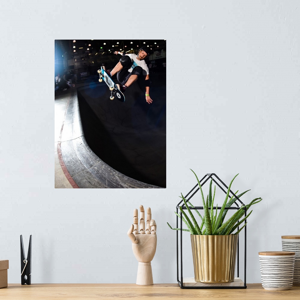 A bohemian room featuring Chris Miller jumping on his skateboard at Vans Off The Wall Skatepark in Huntington Beach, Califo...