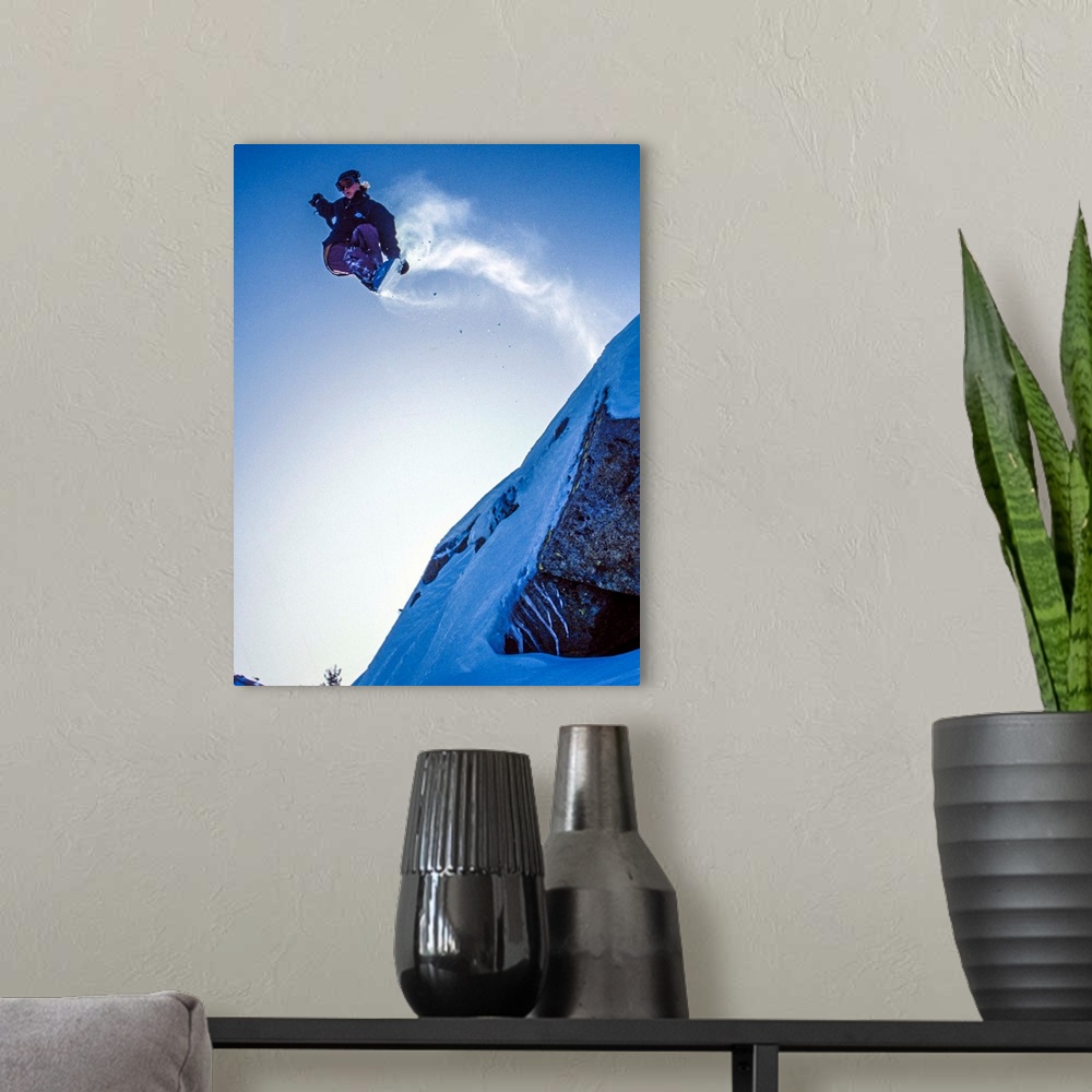 A modern room featuring Noah Styles a cliff jump up on Donner Summit near Lake Tahoe in the winter of 92-93.