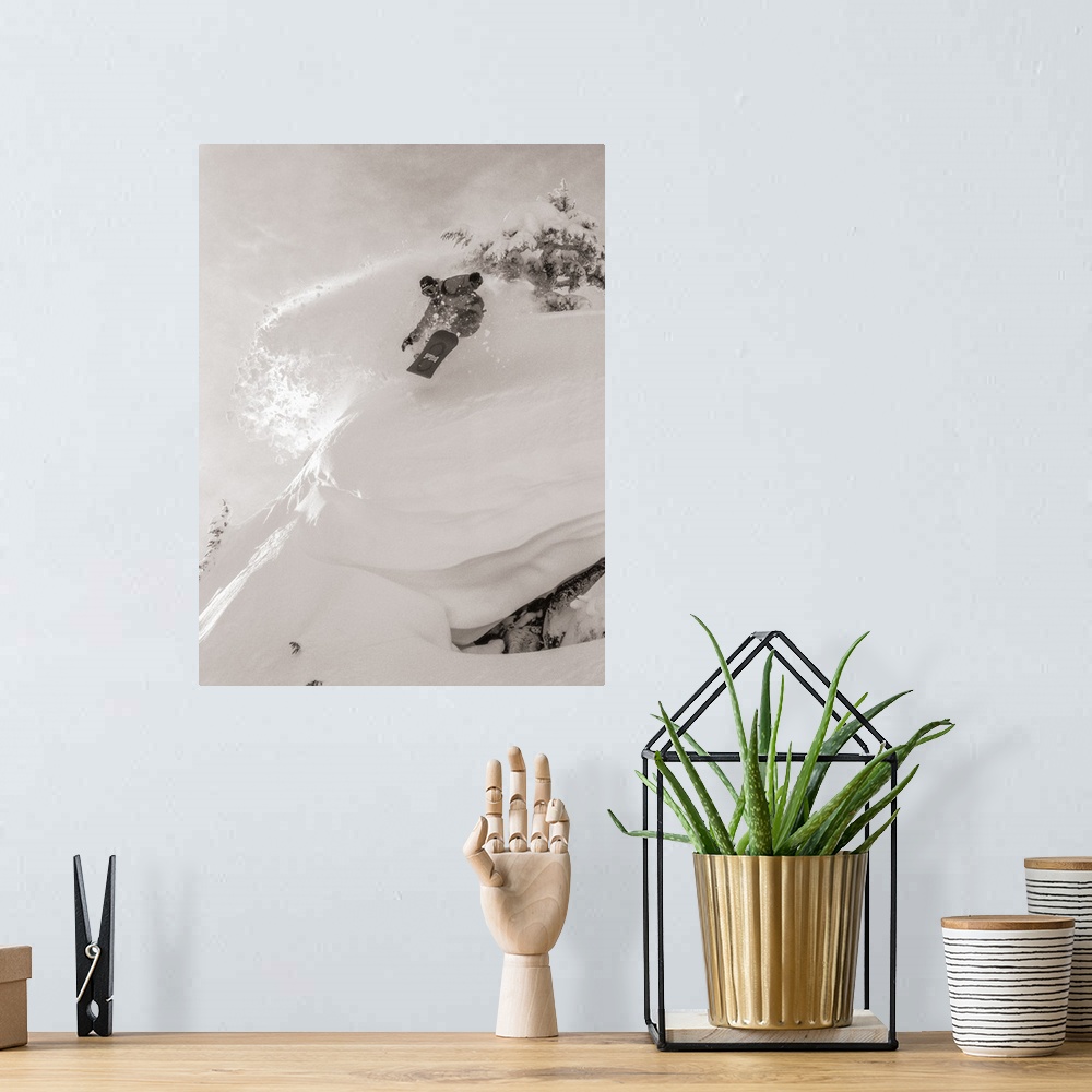 A bohemian room featuring Black and white image of Pat Abramson kicking up powder while snowboarding down Mt. Baker in Wash...