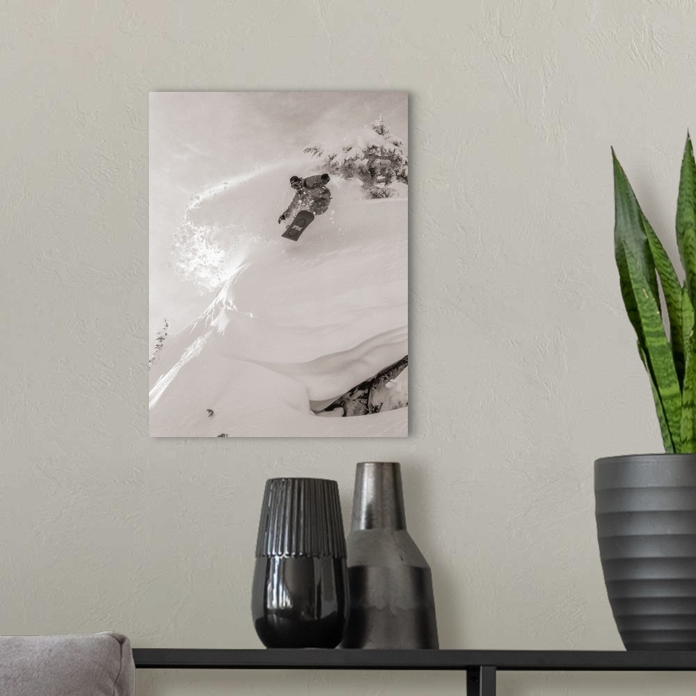 A modern room featuring Black and white image of Pat Abramson kicking up powder while snowboarding down Mt. Baker in Wash...