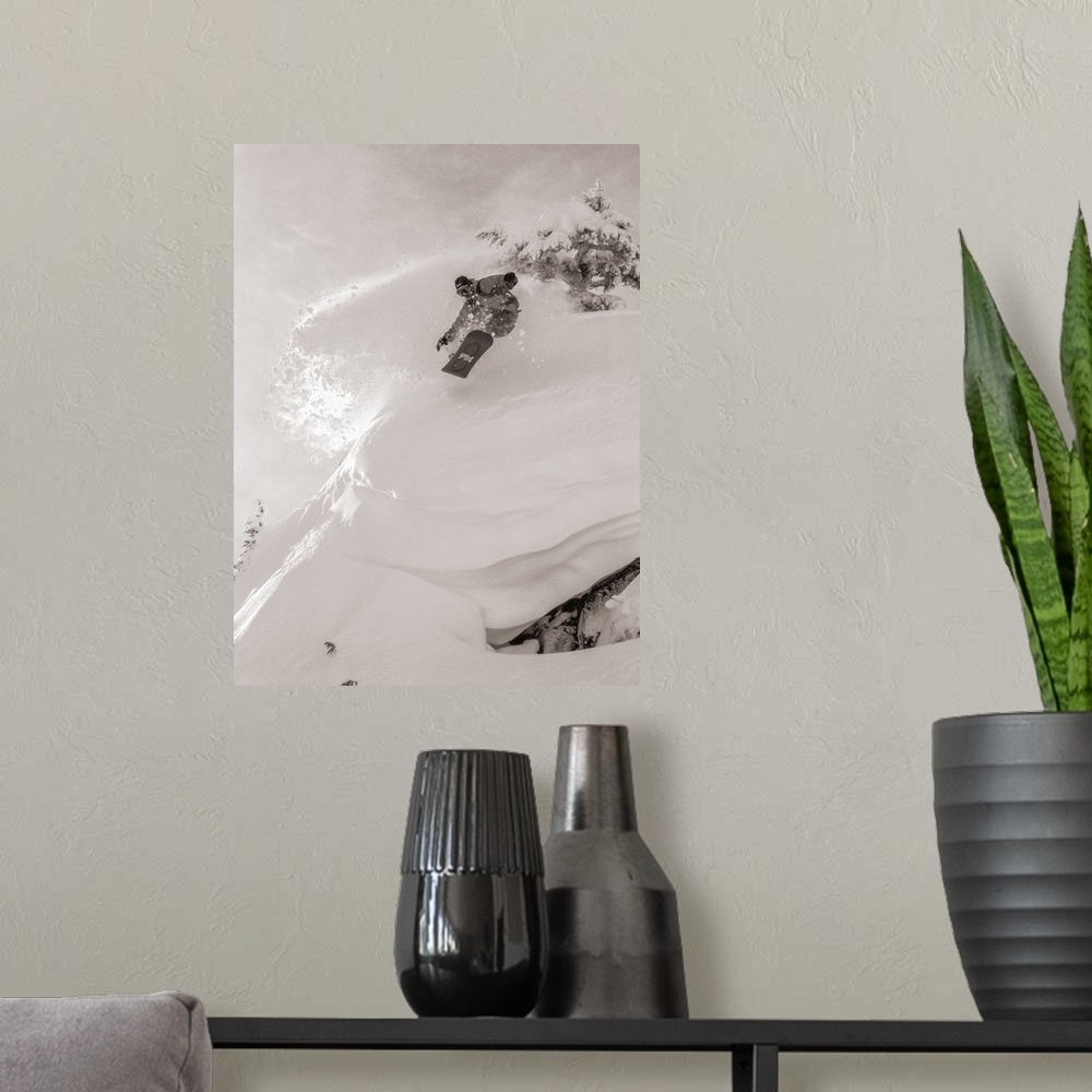 A modern room featuring Black and white image of Pat Abramson kicking up powder while snowboarding down Mt. Baker in Wash...