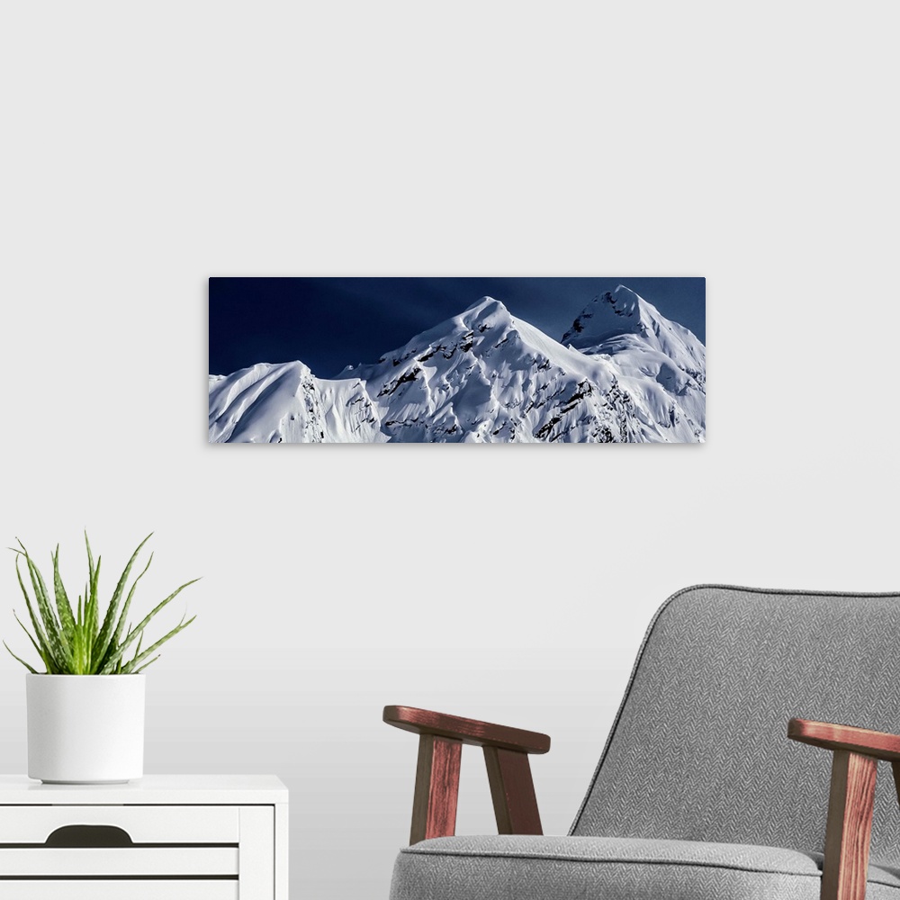 A modern room featuring Snow-covered mountains of Pontoon Peak in the Chugach Range in Alaska.