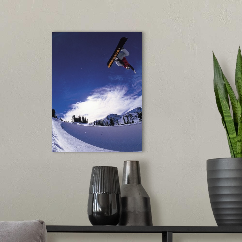 A modern room featuring Scott Eckhard performing a straight air jump at Mammoth Mountain Ski Area, California.