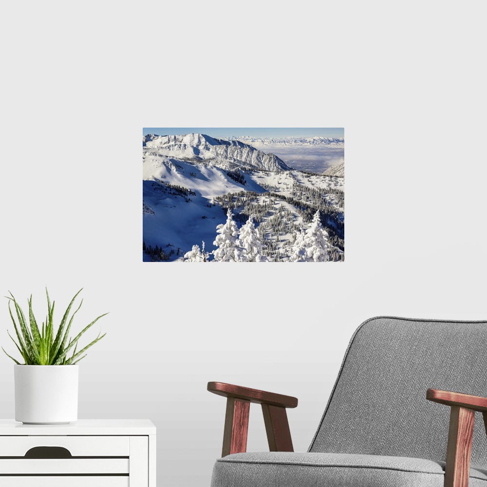 A modern room featuring Landscape photograph of the snow covered Wasatch Range in Utah.