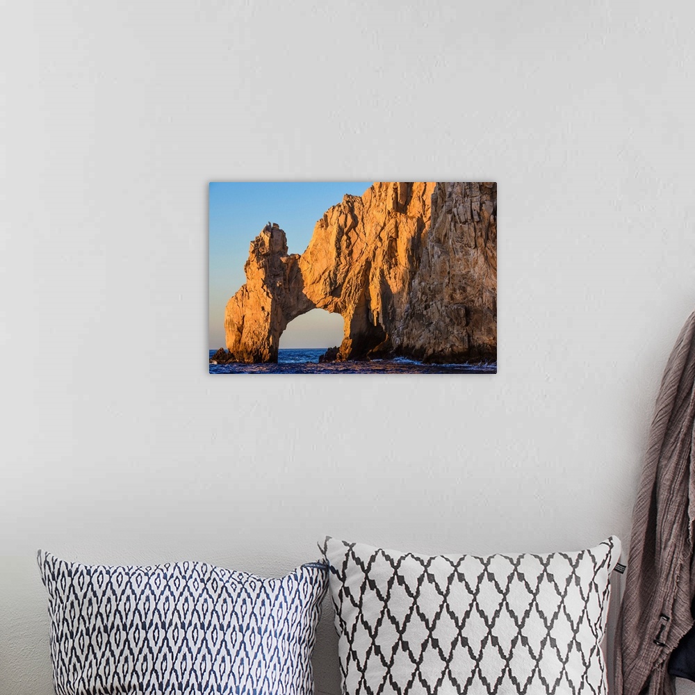 A bohemian room featuring Sunset over the Cabo arch